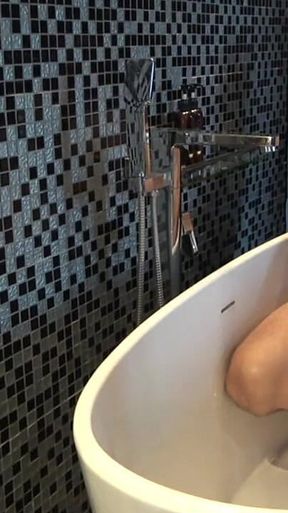 Chubby Stepdaddy Pissing in Bathtub
