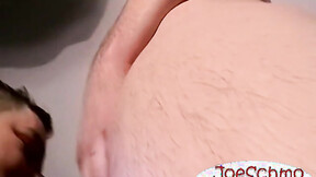A bald ebony dude with a heavy shaft rubbing it til he cums