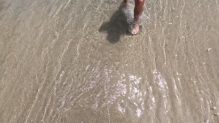 the guy pissed in the sea on public and the girl came to help