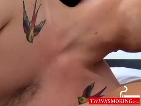 Smoking tattooed twink indulges in wild bareback fucking