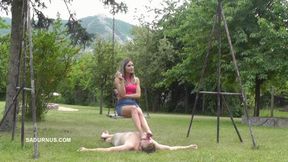 Mistress Tatjana is resting on a swing wmv