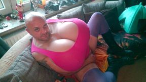 Huge tits Cup-Z crossdresser in a fetish outfit with boots massages and kneads his big breasts. Extremely large xl boobs in pink