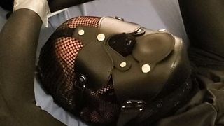 Ballgagged in overall catsuit. Cum with plastic hood