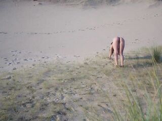FAVOURABLE VOYEUR SCREWS A LARGE BOOTY STRANGER ON THE NUDIST BEACH DURING THE TIME THAT THAT BABE'S DOING EXPOSED YOGA... LARGE CREAMPIE