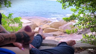 Surprise ejaculation handjob on the beach