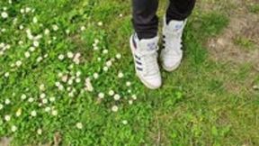 Grass and flowers crush in sneakers