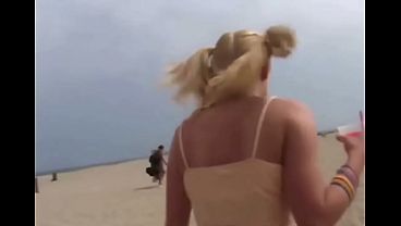 Petite teen masturbating on the beach