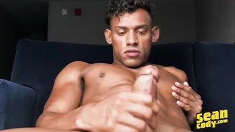 Curly haired green eyed JJ strokes his big dick and cums hard