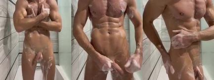 Hunk jerks off in shower while MILF rubs big ass nearby