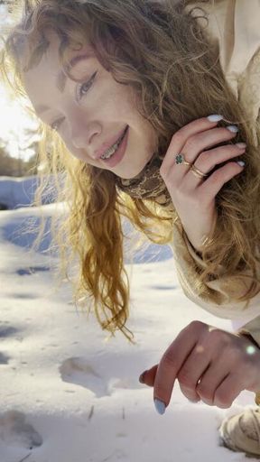 A girl pees on the snow