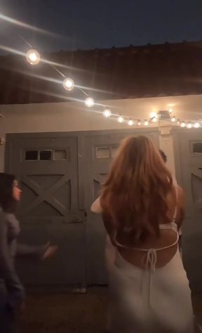 Small nips slip out of her top