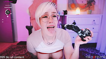 Cute chick sucking on dildo and enjoying herself