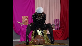 Liligoona the latex tranny doll, playing with a sex doll and a dildo. High quality audio with sloppy sounds.