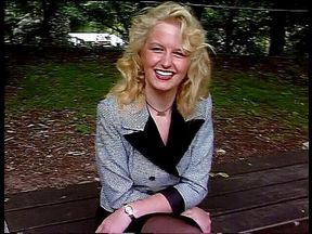 Classy blonde giving an outdoor interview