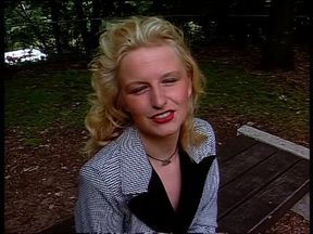 Classy blonde giving an outdoor interview
