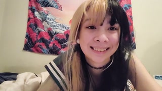 Asian sailor plays with her self