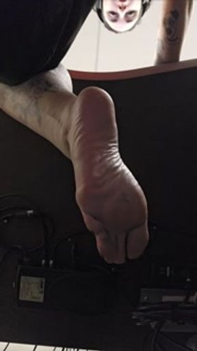 POV: bored goth girl ignores pathetic footboy beneath her feet
