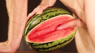 Muscular dude creams a water melon with his cumshot