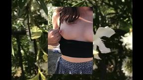 big boobed teen pleasures herself in a public garden
