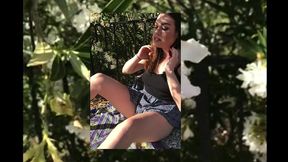 big boobed teen pleasures herself in a public garden