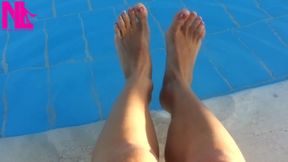 Barefoot Dangling in Swimming Pool Water
