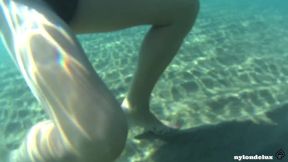 White pantyhose on the beach