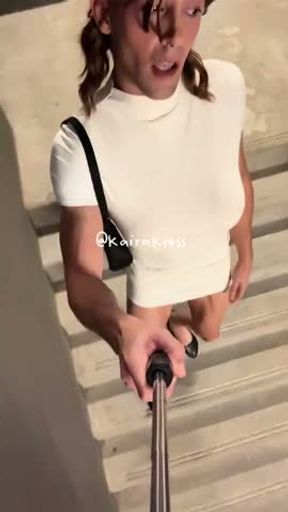 Sissy walks around in tight dress with fake boobs