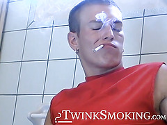 Attractive Yuri fires up his cig and sits on the toilet for his hot smokin and strokin session