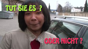 German slut with Asian origins stuffs her cunt with dildo