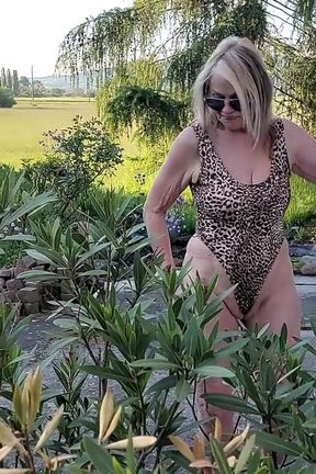 Martina in a Shiny Leopard Swimsuit