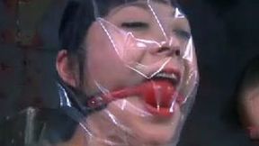 Wicked mistress puts a plastic bag over her slave's head