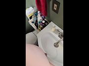 Thick trans girl feels herself up while pissing