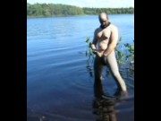 jerking off in lake wearing spandex tights, latex gloves and stocking mask