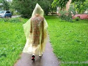 Risky flash of boobs and butt in the rain in a transparent raincoat