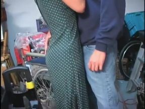 Watch fake titty MILF get on the floor and suck his penis
