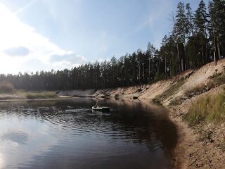 Undressed cutie in boat and walk in the swamp