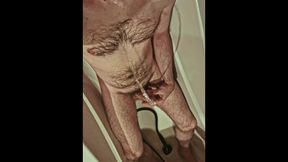 Fur covered uncircumcised boy urinates on himself and in his jaws, tastes his own urinate in the shower