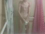 Hot very skinny guy with flat butt strokes his wet cock and pisses