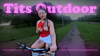 Riding a bike and showing my tits. Outdoor