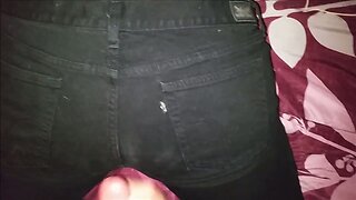 Cumshot on black jeans