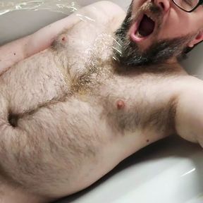 Some solo chastity watersports in the bath for this piss thirsty locked bear