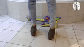 Guitar under wooden clogs