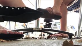 Candid flats dangling under table