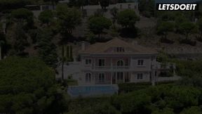 Step-sisters enjoy lesbian sex by the pool in a romantic setting.