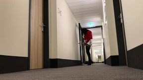 Crossdresser exposing in hotel hallway
