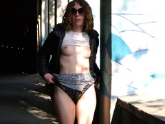 Sexy European teen flashing her tits and pussy in public