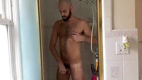 Jerk and bust a load in the shower after shaving head