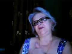 Russian granny ex-teacher flashing her big tits on  webcam