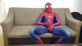 Horny Spiderman jerks off and cums massive load