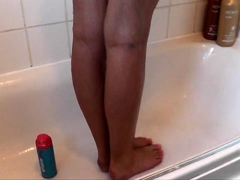 Pink labia close up of naive brunette playing with her name